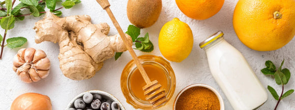 A warm cup of traditional immunity booster kadha, surrounded by ingredients like ginger, tulsi, and cinnamon.