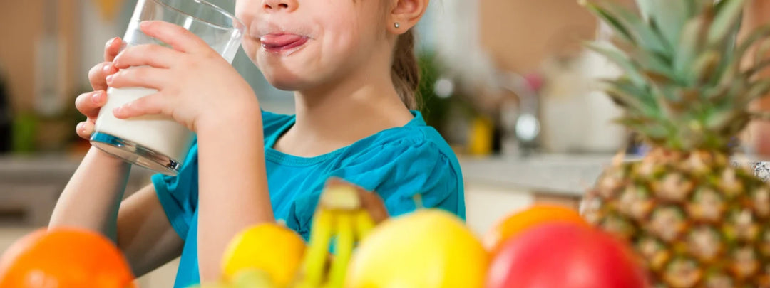 A child happily eating a healthy meal, representing boosted kids metabolism and natural nutrition. 