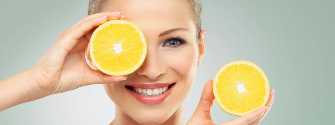 A vibrant flat lay of fruits, vegetables, and nuts representing what to eat for glowing skin. 