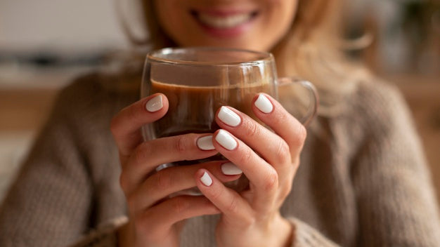 Closeup Blurry Woman Holding Drink