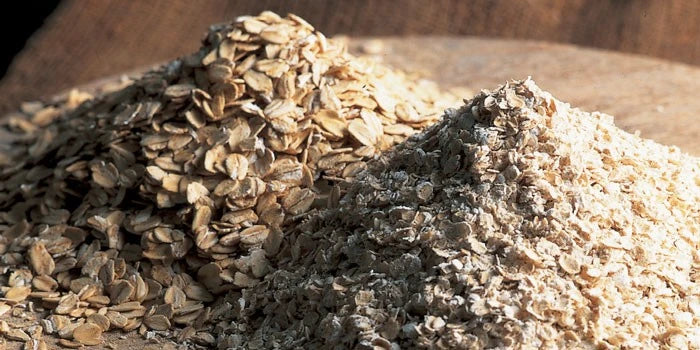Close-up of oat bran flakes showing texture and color. 